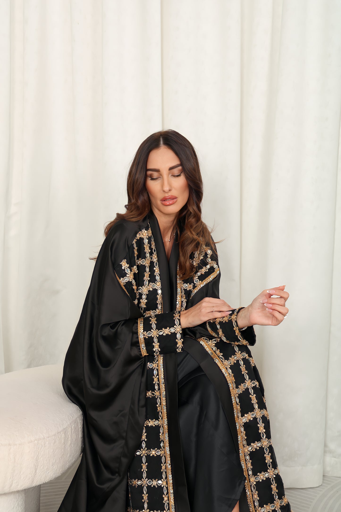 Black silk Abaya embroidered with gold stones and mirrors