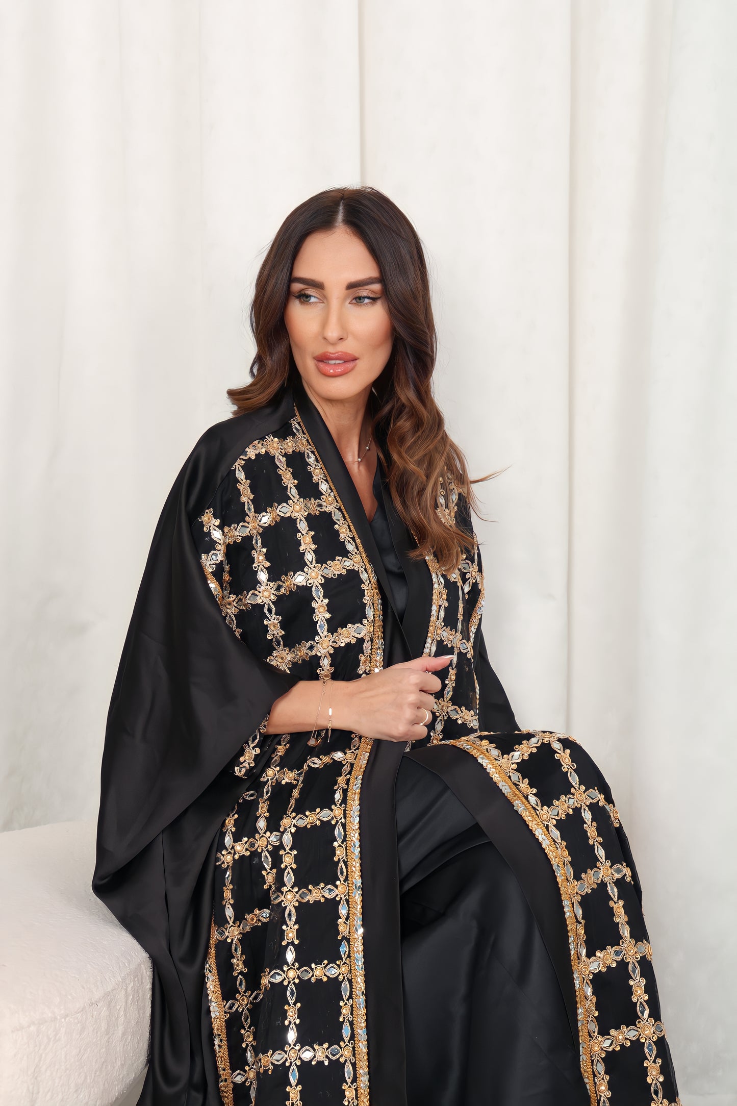 Black silk Abaya embroidered with gold stones and mirrors