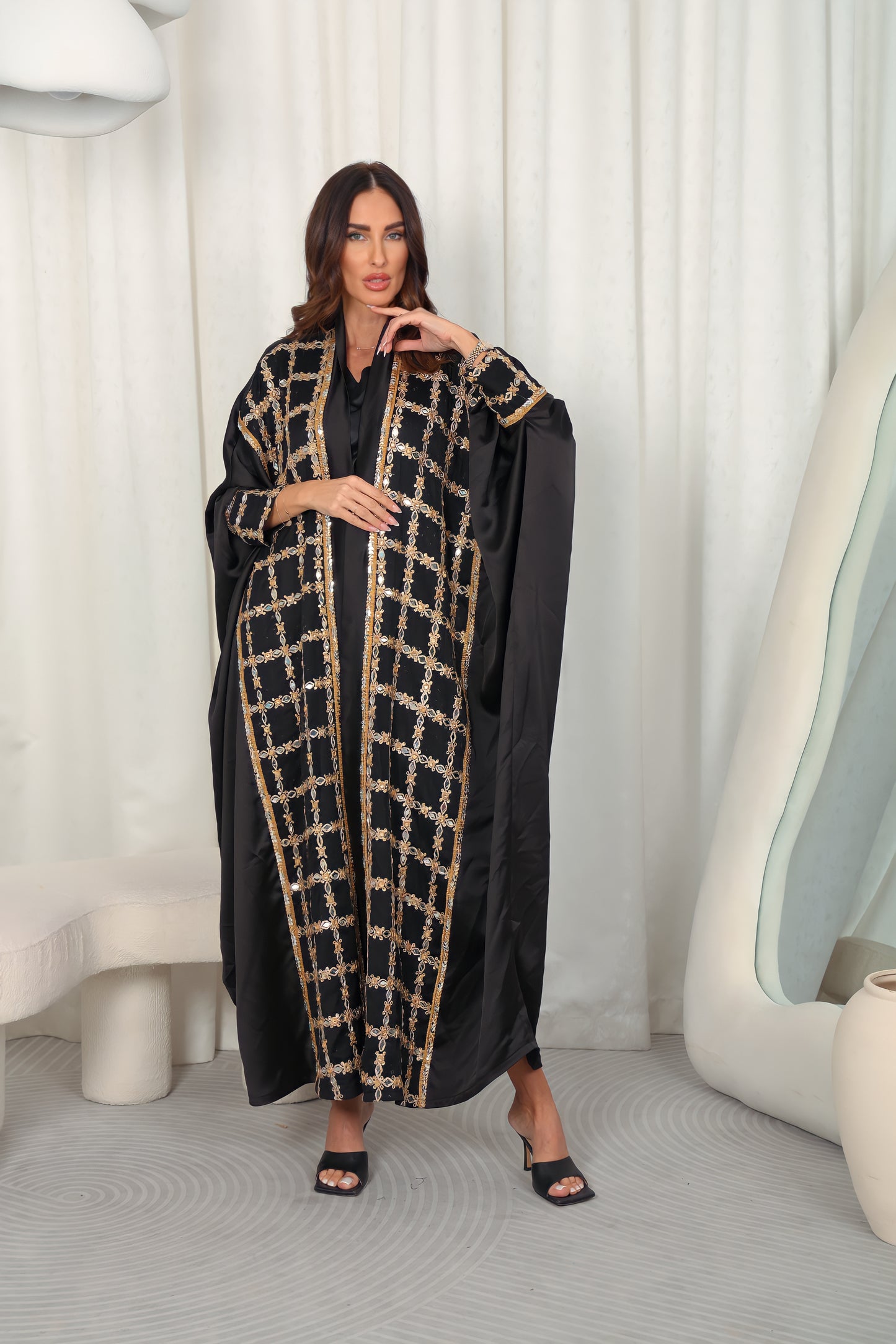 Black silk Abaya embroidered with gold stones and mirrors