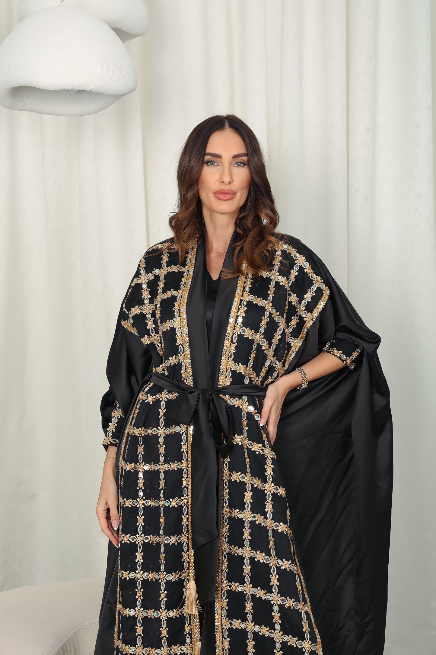 Black silk Abaya embroidered with gold stones and mirrors