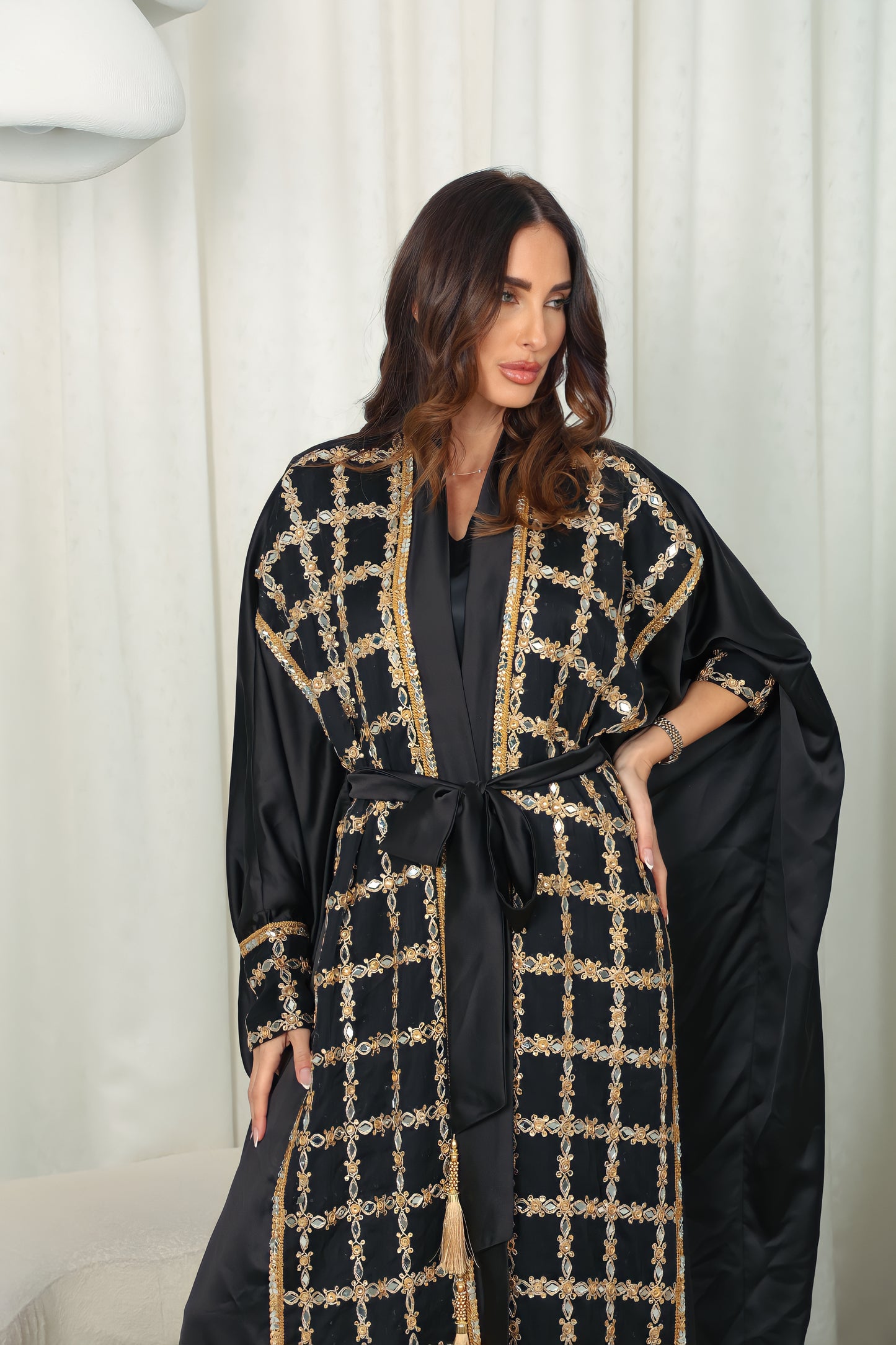 Black silk Abaya embroidered with gold stones and mirrors