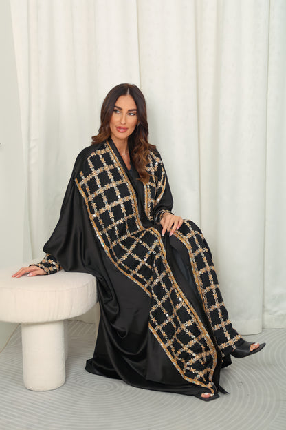 Black silk Abaya embroidered with gold stones and mirrors