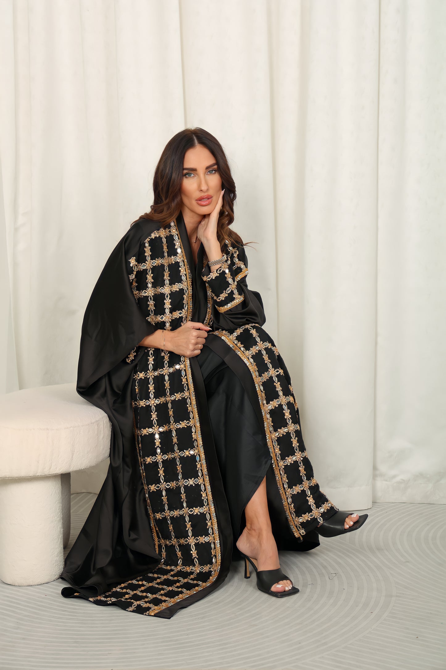 Black silk Abaya embroidered with gold stones and mirrors