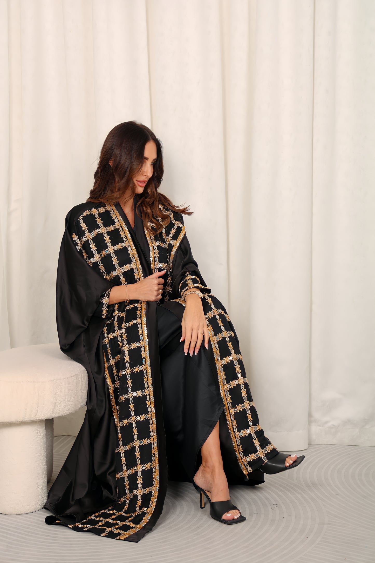 Black silk Abaya embroidered with gold stones and mirrors